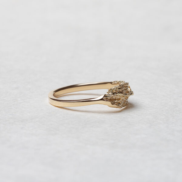 he Ocean Wave Ring available in fair-mined 14k yellow gold, featuring a sophisticated wave design with a luxurious finish