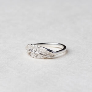 Close-up of the Ocean Wave Ring featuring a blend of lustrous and matte silver