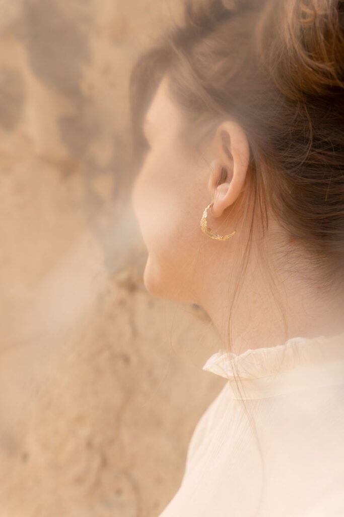 Model with Ocean Wave earrings